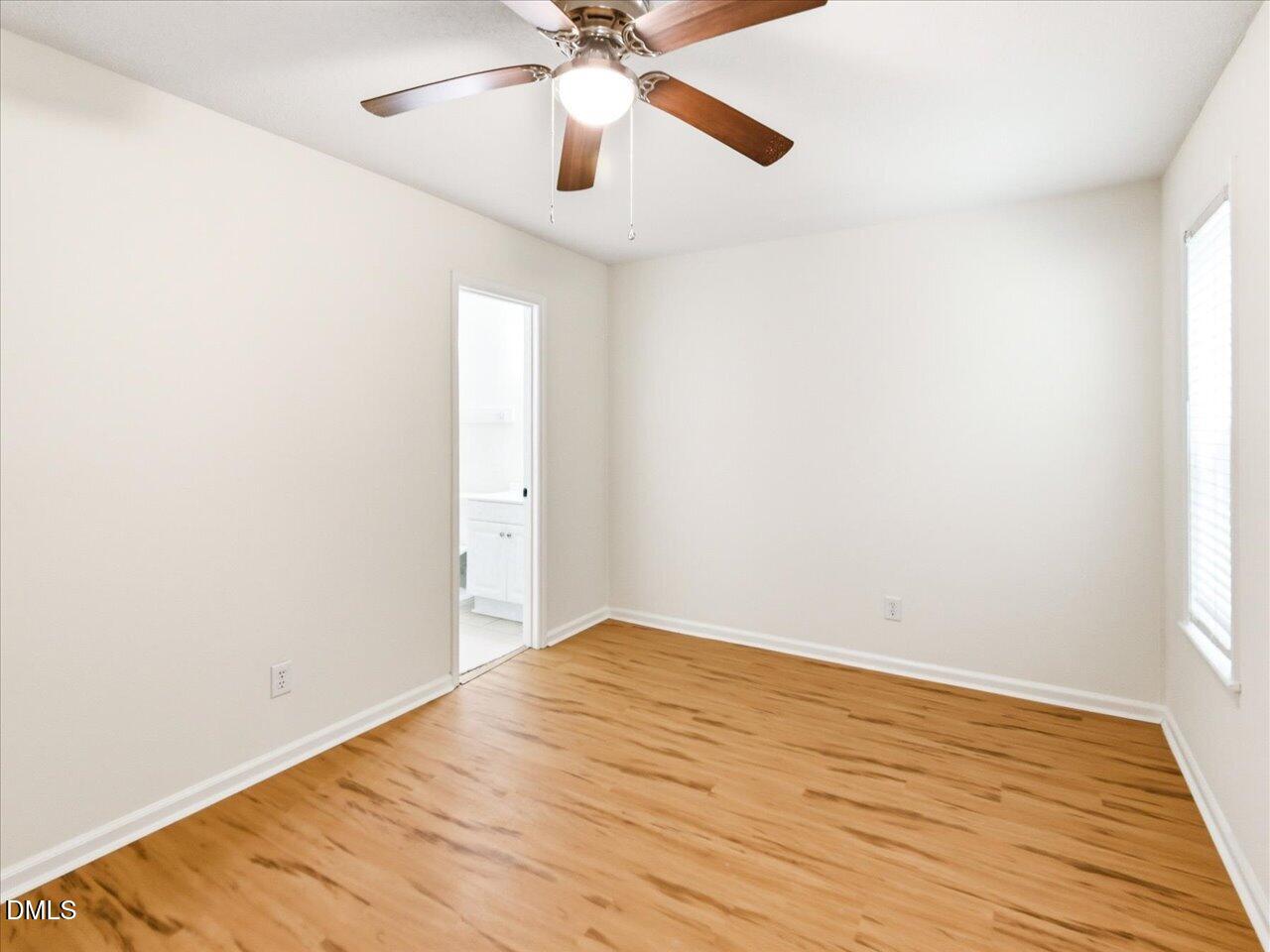 332 Ashley Forest Road Chapel Hill, NC 27514 - Photo 25 of 44 a view of an empty room with wooden floor
