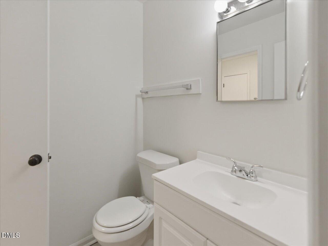 332 Ashley Forest Road Chapel Hill, NC 27514 - Photo 26 of 44 a bathroom with a sink a toilet and mirror
