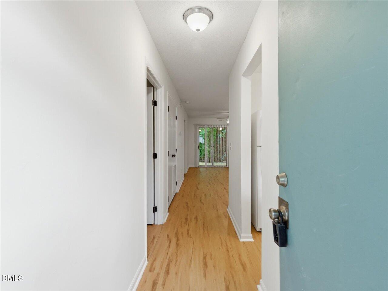 332 Ashley Forest Road Chapel Hill, NC 27514 - Photo 4 of 44 a view of a hallway with wooden floor and staircase