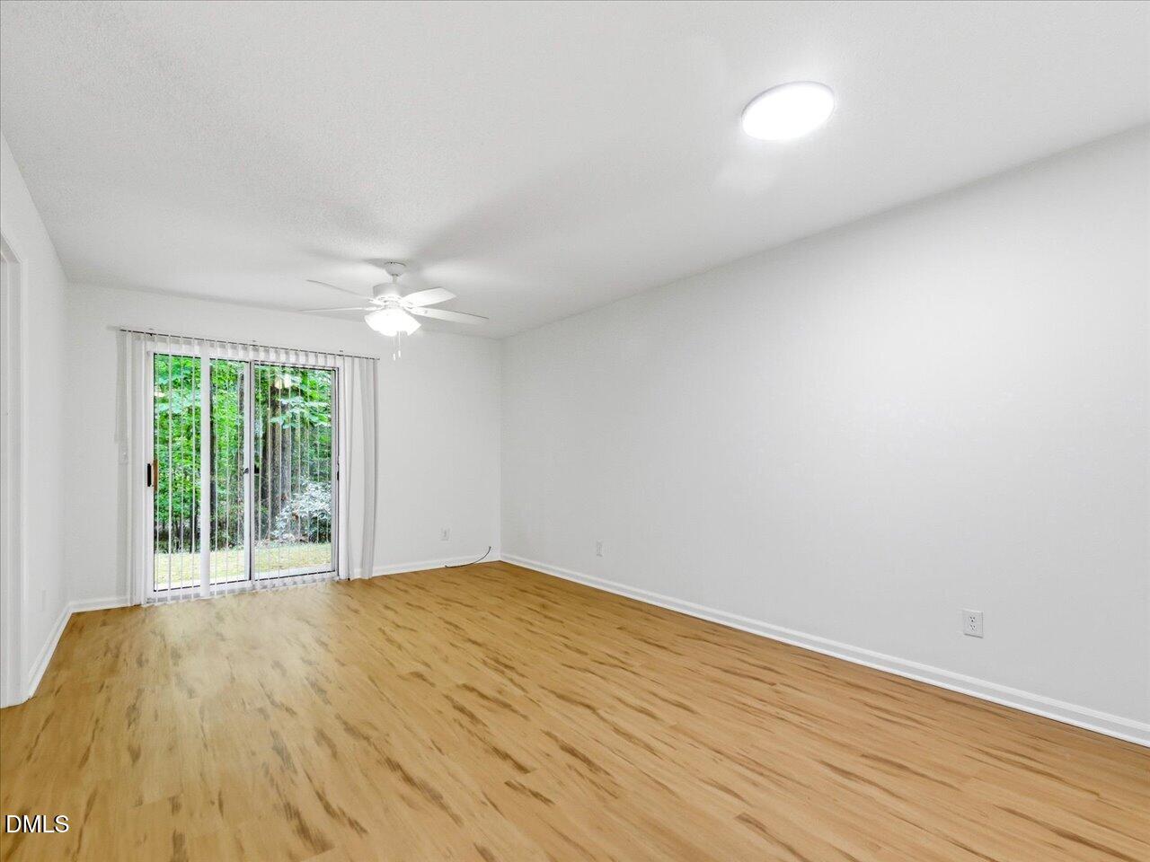 332 Ashley Forest Road Chapel Hill, NC 27514 - Photo 6 of 44 a view of empty room with wooden floor and fan