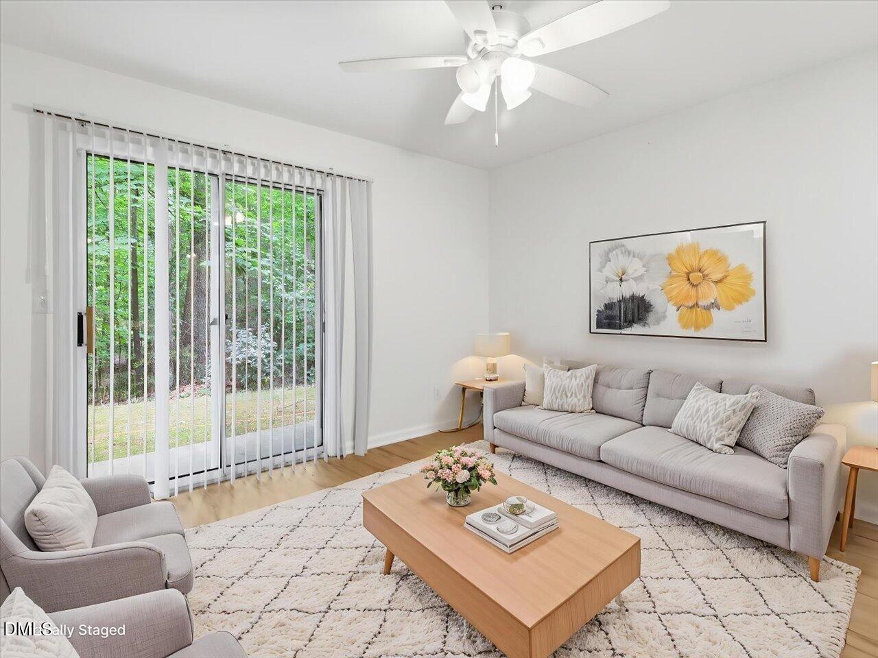 332 Ashley Forest Road Chapel Hill, NC 27514 - Photo 8 of 44 a living room with furniture and a large window