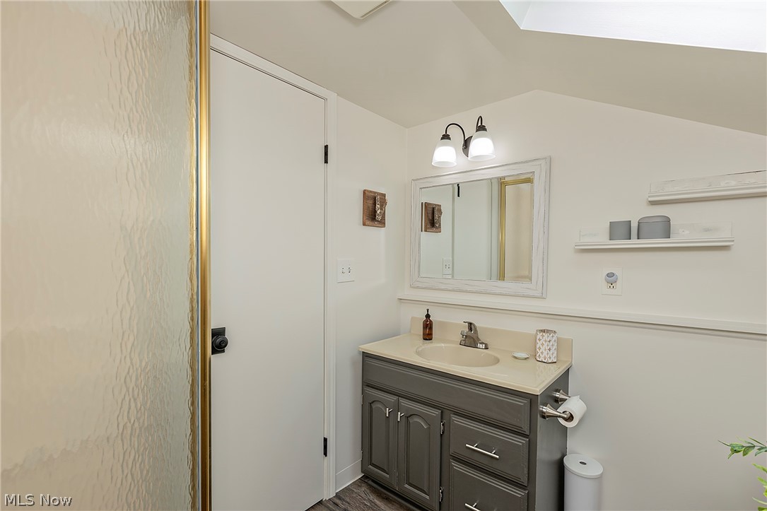 11292 Butternut Road Chardon, OH 44024 - Photo 33 of 49 Bathroom featuring a gray vanity with an integrated sink and light-colored countertop