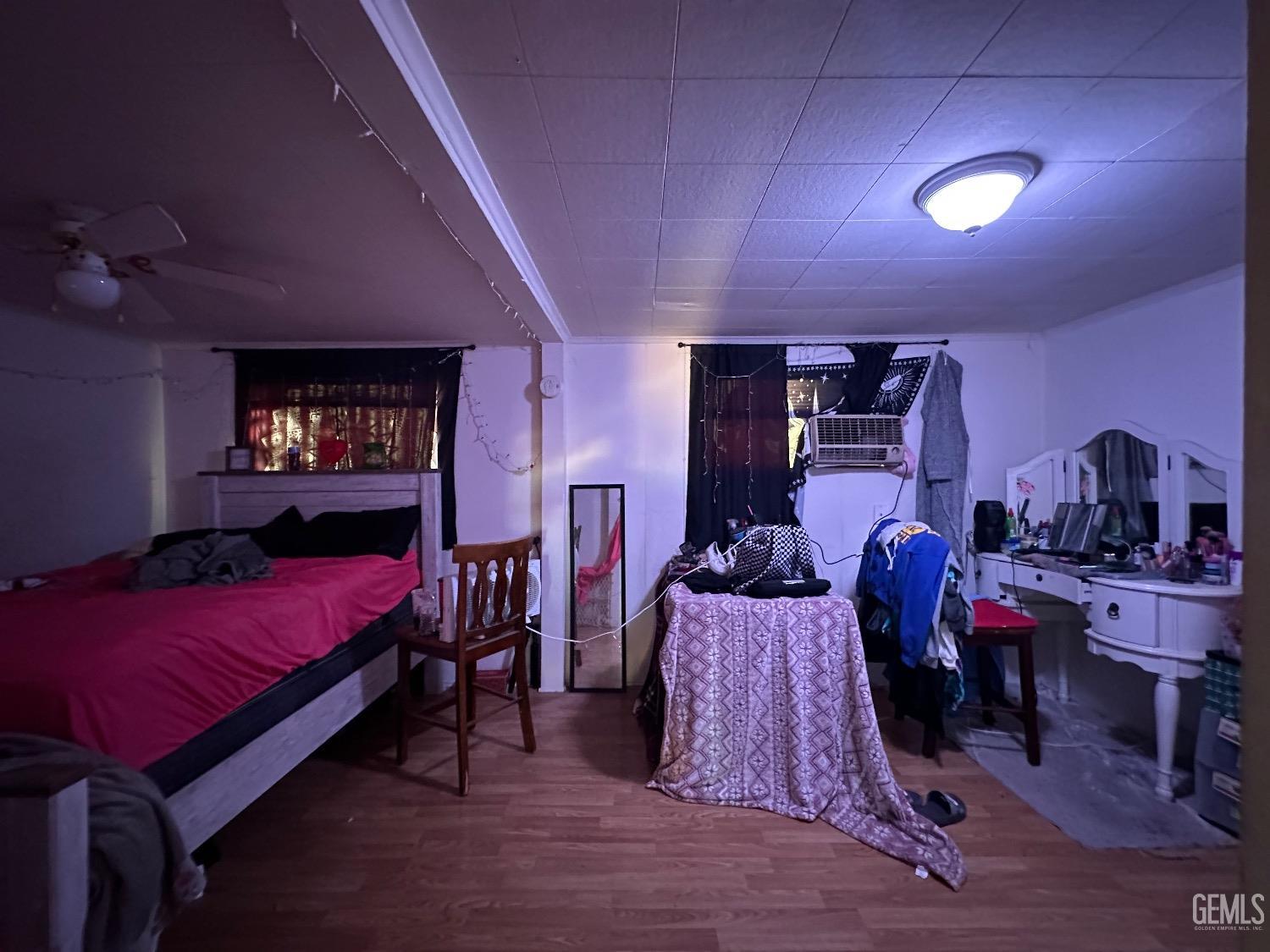 Undisclosed Address Taft, CA 93268 - Photo 14 of 22 a bed room with a bed and a lamp