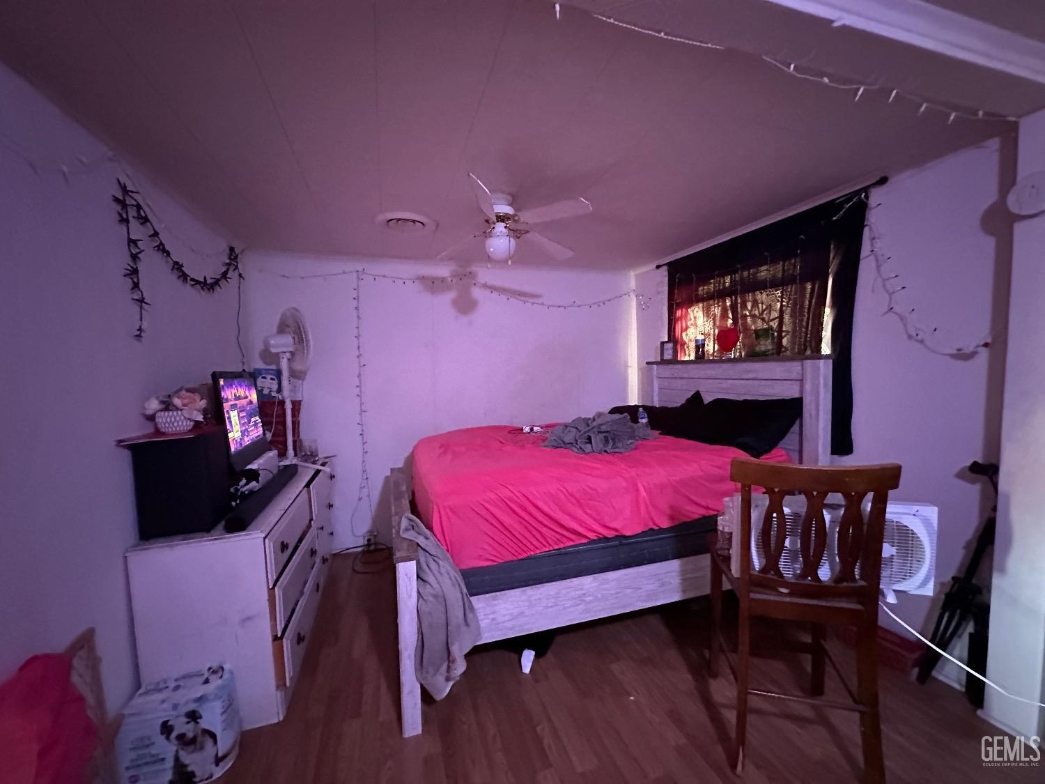 Undisclosed Address Taft, CA 93268 - Photo 15 of 22 a bed room with a bed and a television