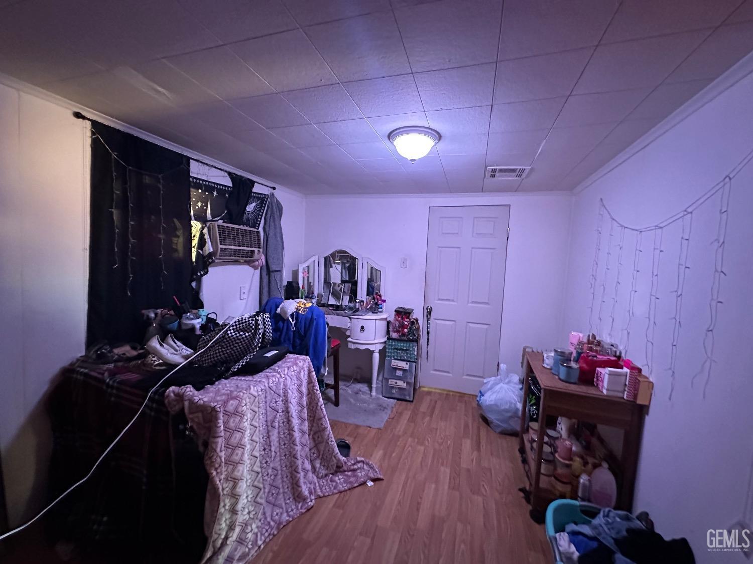 Undisclosed Address Taft, CA 93268 - Photo 16 of 22 a living room with furniture and wooden floor