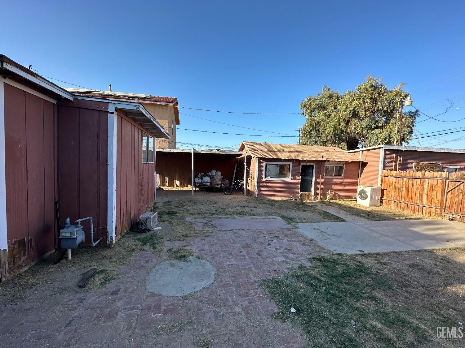 Undisclosed Address Taft, CA 93268 - Photo 18 of 22 a view of a house with a backyard