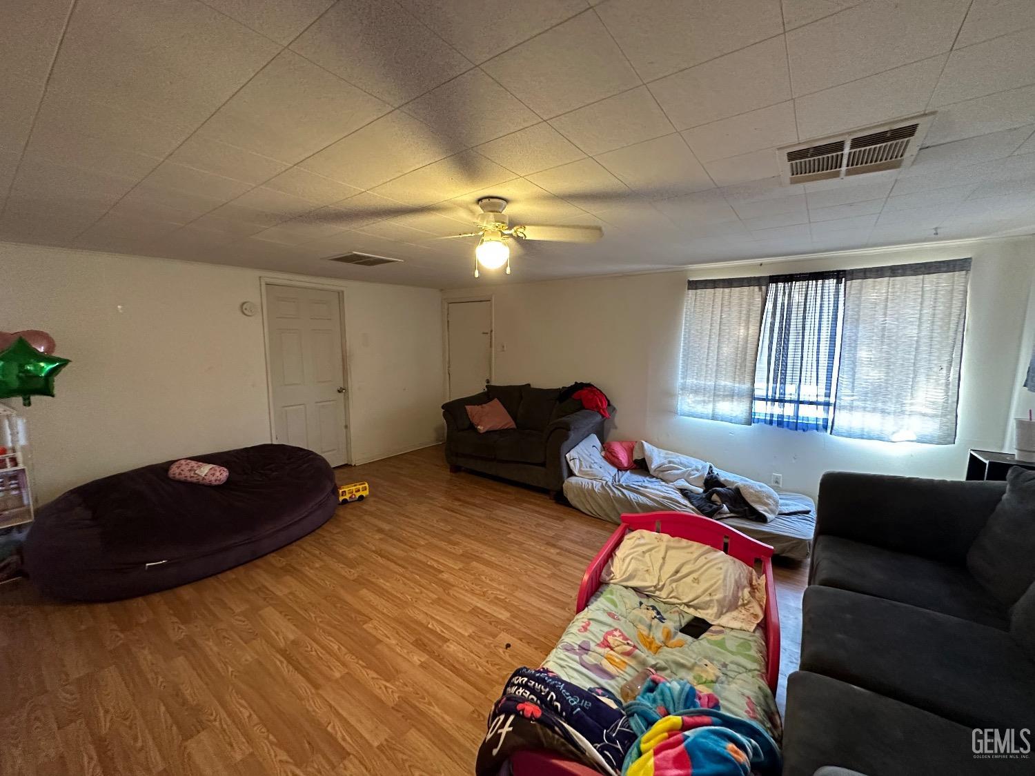 Undisclosed Address Taft, CA 93268 - Photo 5 of 22 a bedroom with a bed and a couch