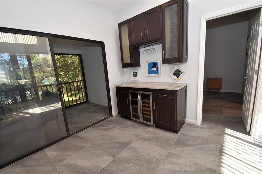 1508 Pelican Cove Road, Unit GR233 Sarasota, FL 34231 - Photo 20 of 37 a spacious bathroom with a tub sink and mirror