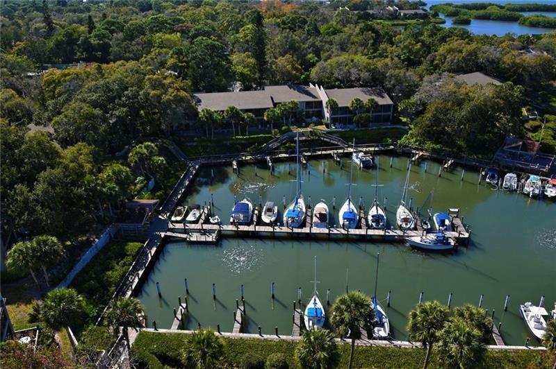 1508 Pelican Cove Road, Unit GR233 Sarasota, FL 34231 - Photo 31 of 37 an aerial view of a house with a lake view