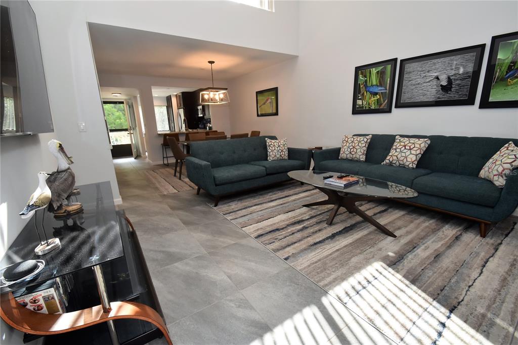 1508 Pelican Cove Road, Unit GR233 Sarasota, FL 34231 - Photo 10 of 37 a living room with furniture and wooden floor