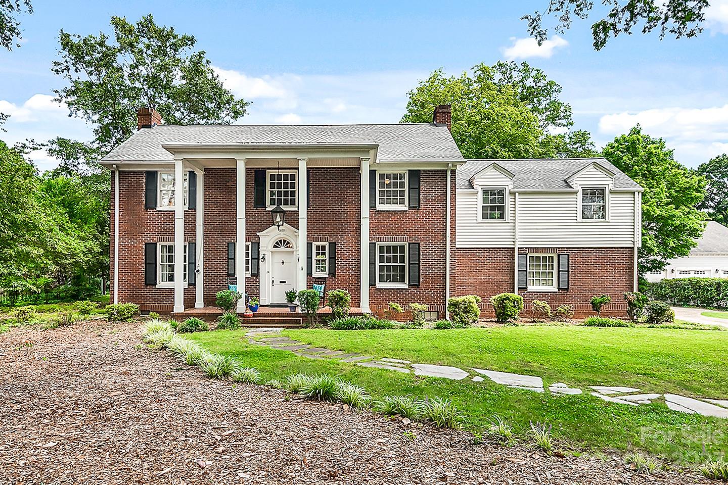 1601 South Wendover Road Charlotte, NC 28211 - Photo 1 of 43 a front view of a house with a yard and trees