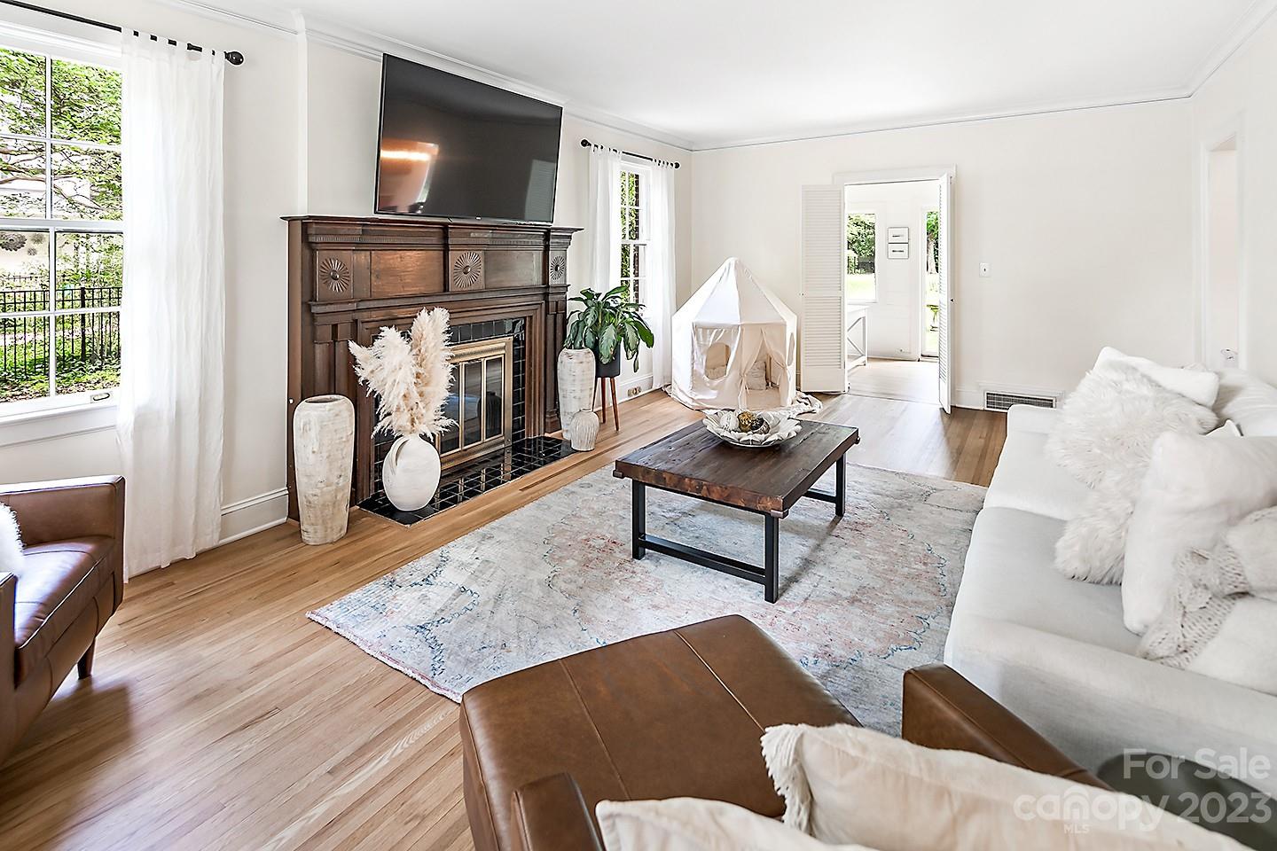 1601 South Wendover Road Charlotte, NC 28211 - Photo 20 of 43 a living room with furniture and a fireplace