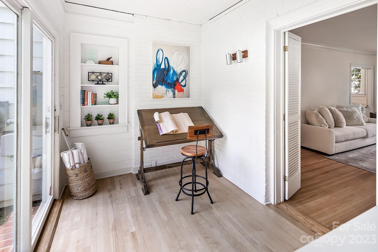 1601 South Wendover Road Charlotte, NC 28211 - Photo 21 of 43 a bedroom with furniture and a wooden floor