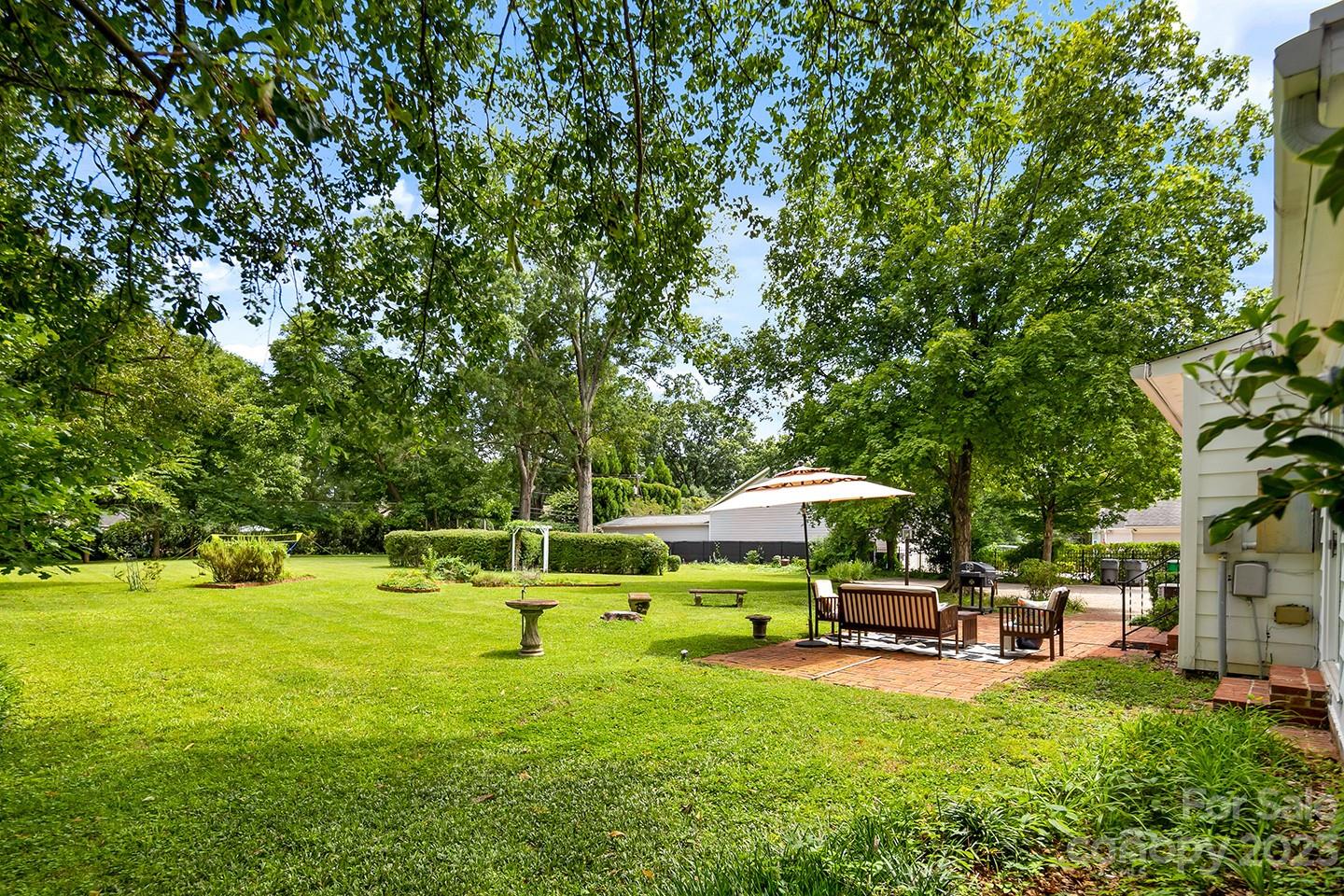 1601 South Wendover Road Charlotte, NC 28211 - Photo 3 of 43 a swimming pool with outdoor seating and yard