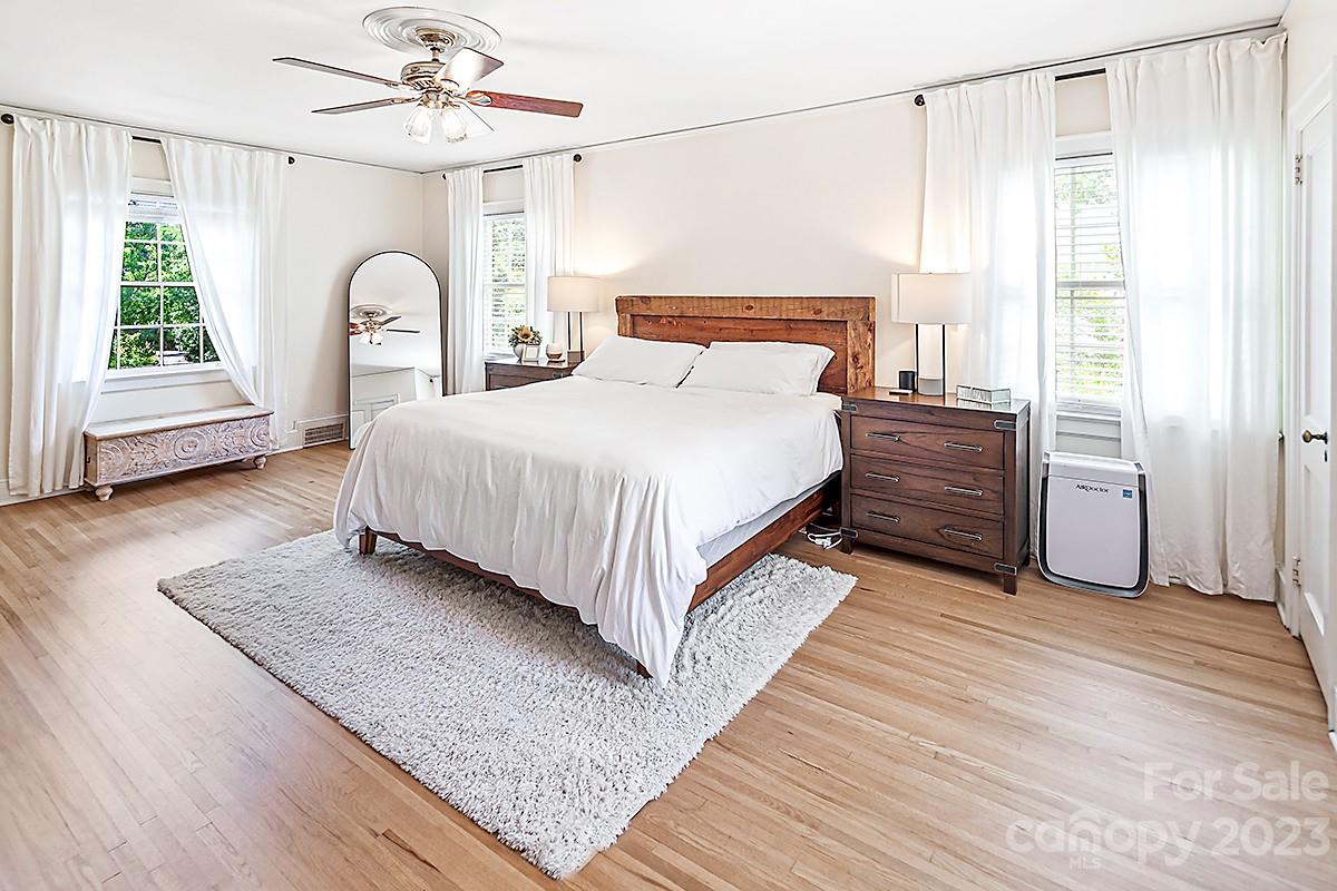 1601 South Wendover Road Charlotte, NC 28211 - Photo 32 of 43 a bedroom with a bed lamp closet and window