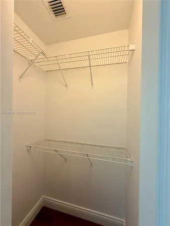 a bathroom with a double vanity sink and mirror