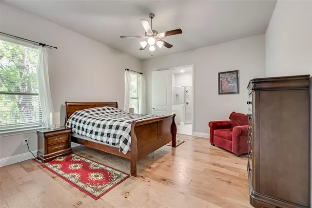 a bathroom with double vanity sink a mirror and a shower