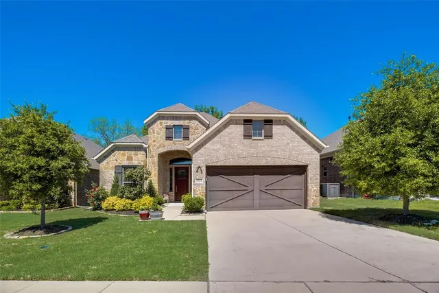 wooden floor with a chandelier in a room
