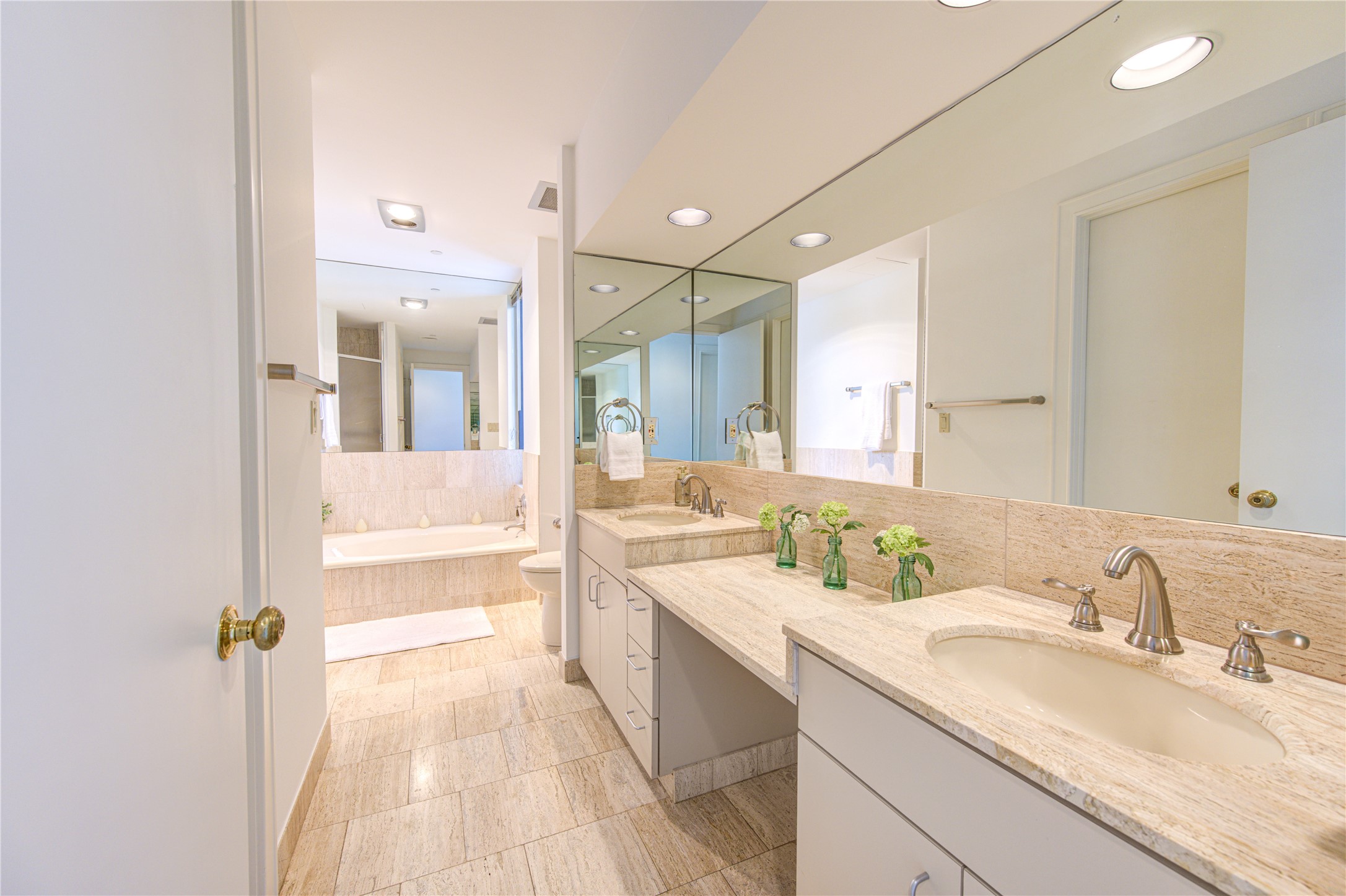 150 Gessner Road, Unit 5A Houston, TX 77024 - Photo 20 of 36 a bathroom with a sink double vanity and a mirror