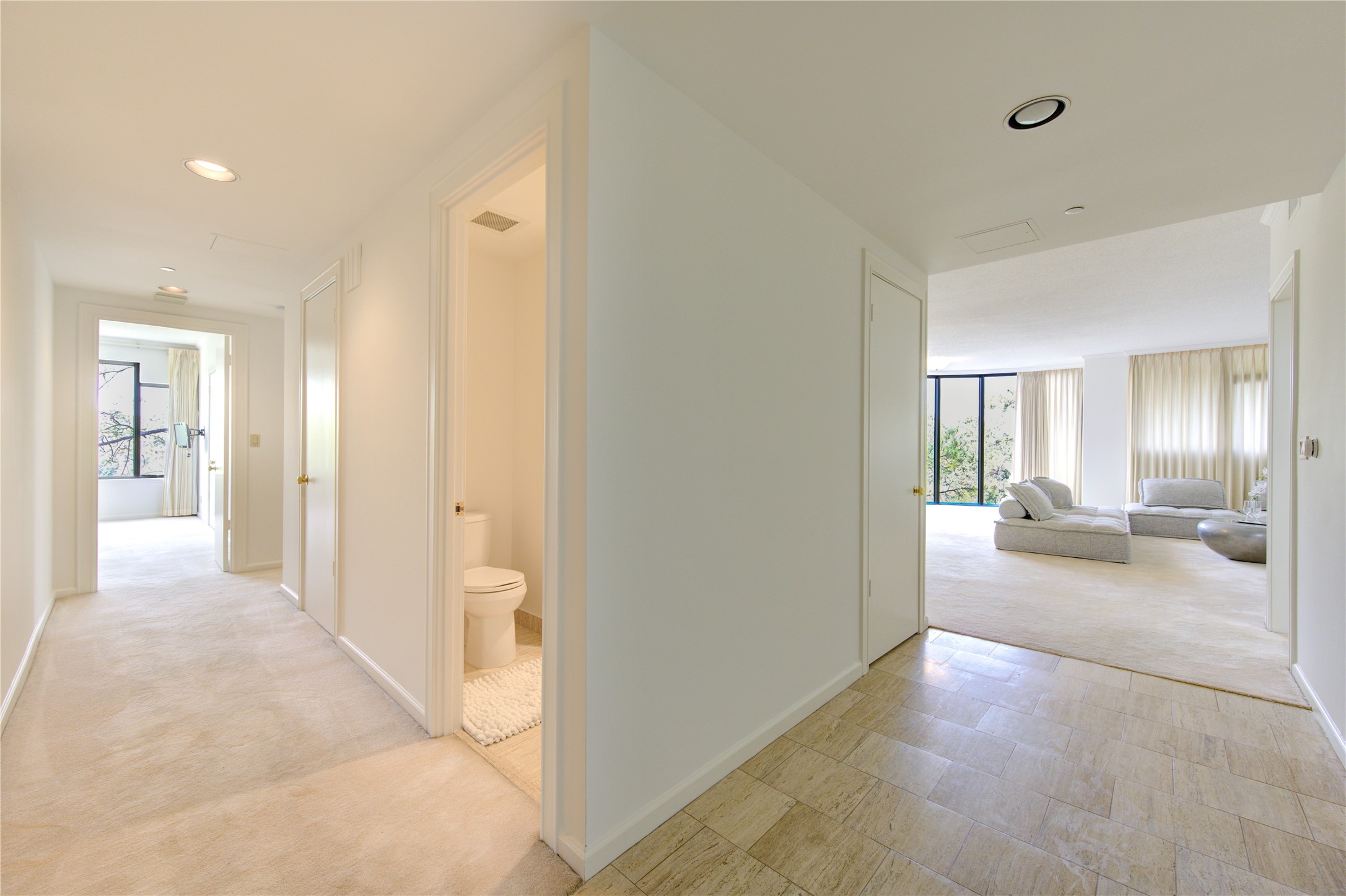 150 Gessner Road, Unit 5A Houston, TX 77024 - Photo 24 of 36 a view of a hallway to a livingroom and a livingroom with furniture