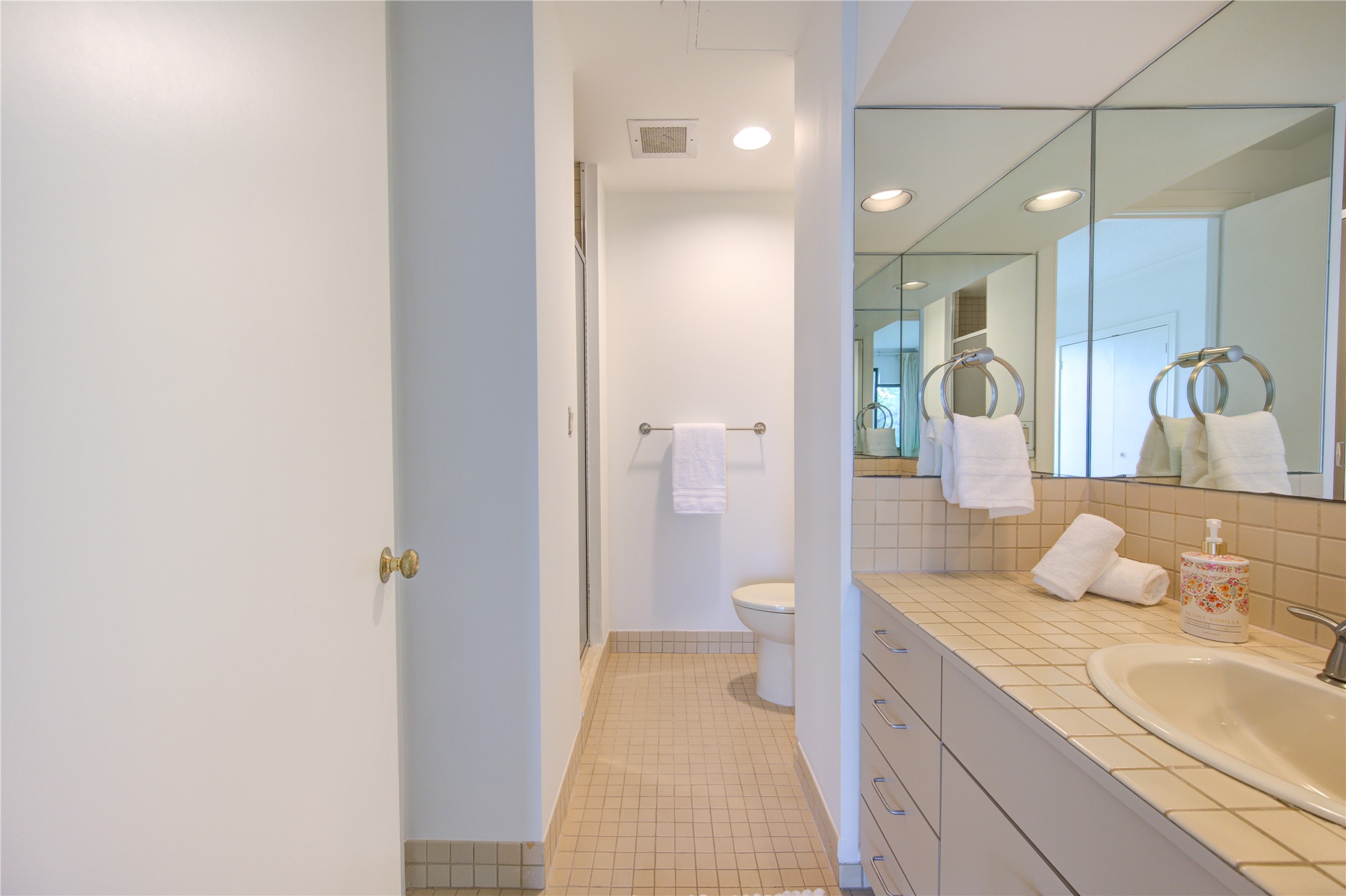 150 Gessner Road, Unit 5A Houston, TX 77024 - Photo 27 of 36 a bathroom with a granite countertop sink a toilet and shower