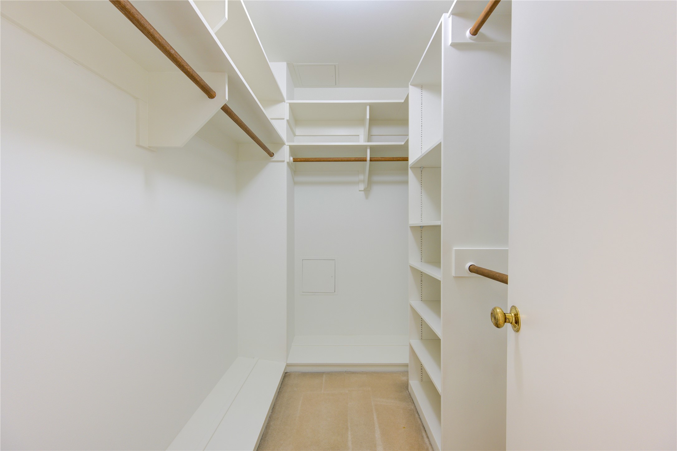 150 Gessner Road, Unit 5A Houston, TX 77024 - Photo 30 of 36 a view of walk in closet with empty racks