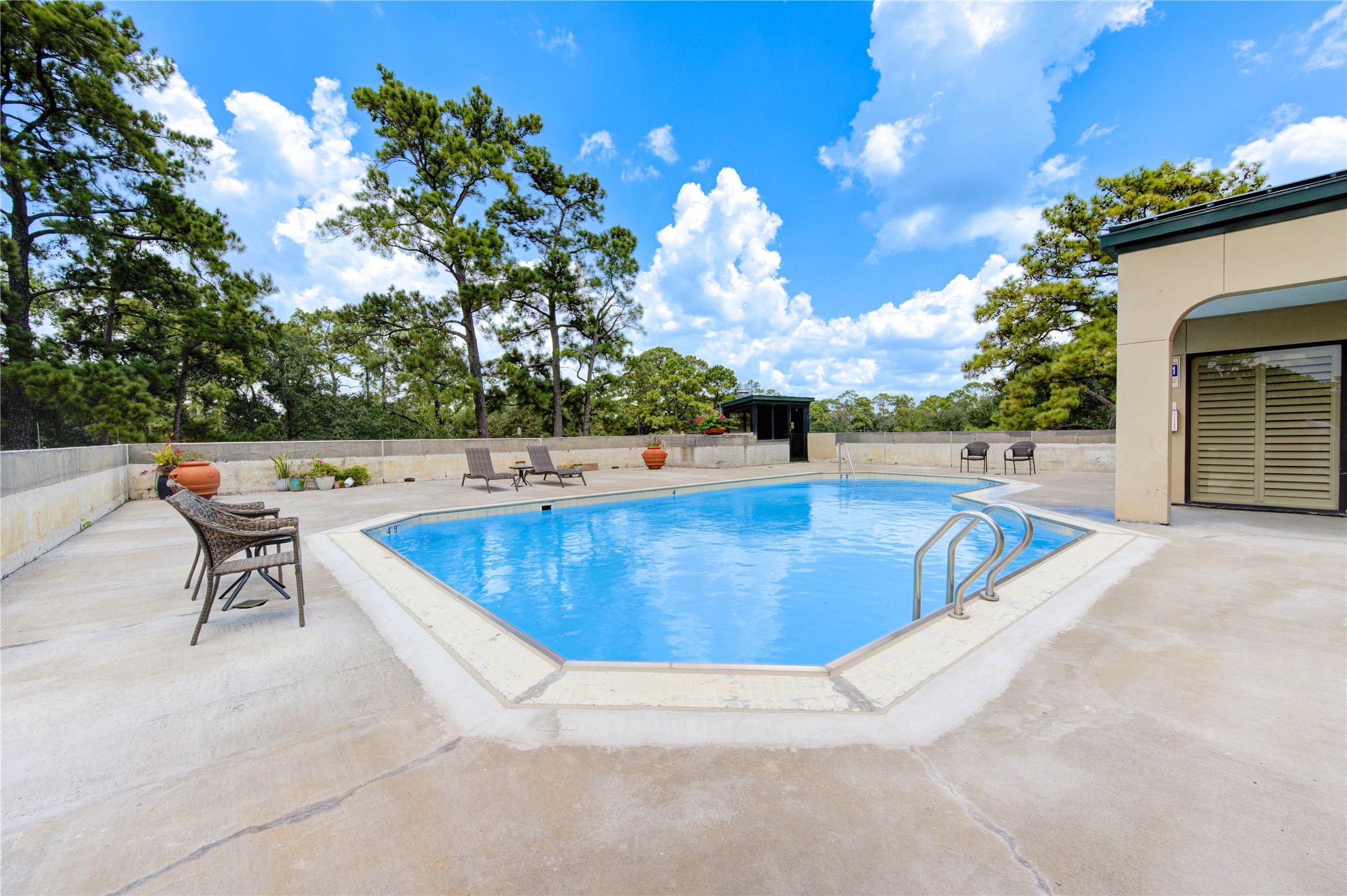 150 Gessner Road, Unit 5A Houston, TX 77024 - Photo 33 of 36 a view of outdoor space and swimming pool