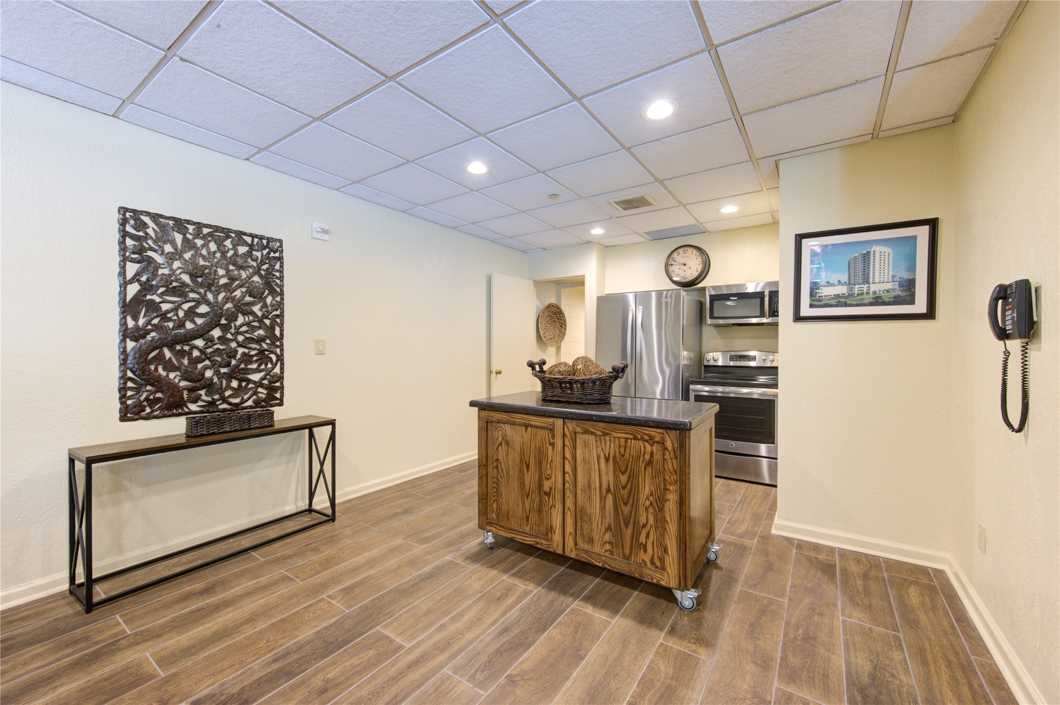150 Gessner Road, Unit 5A Houston, TX 77024 - Photo 35 of 36 a view of kitchen with furniture and wooden floor