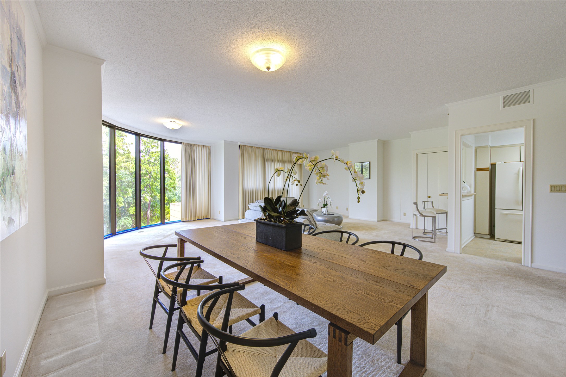 150 Gessner Road, Unit 5A Houston, TX 77024 - Photo 4 of 36 a view of a dining room with furniture and chandelier