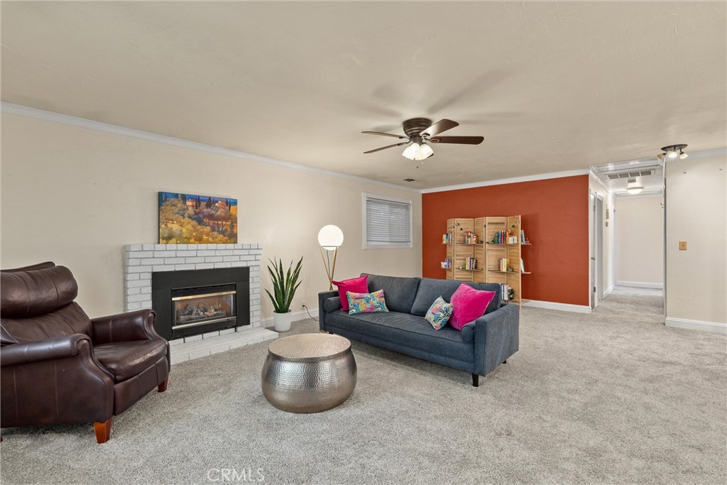 3030 Silverbell Road Chico, CA 95973 - Photo 15 of 42 a living room with furniture and a fireplace
