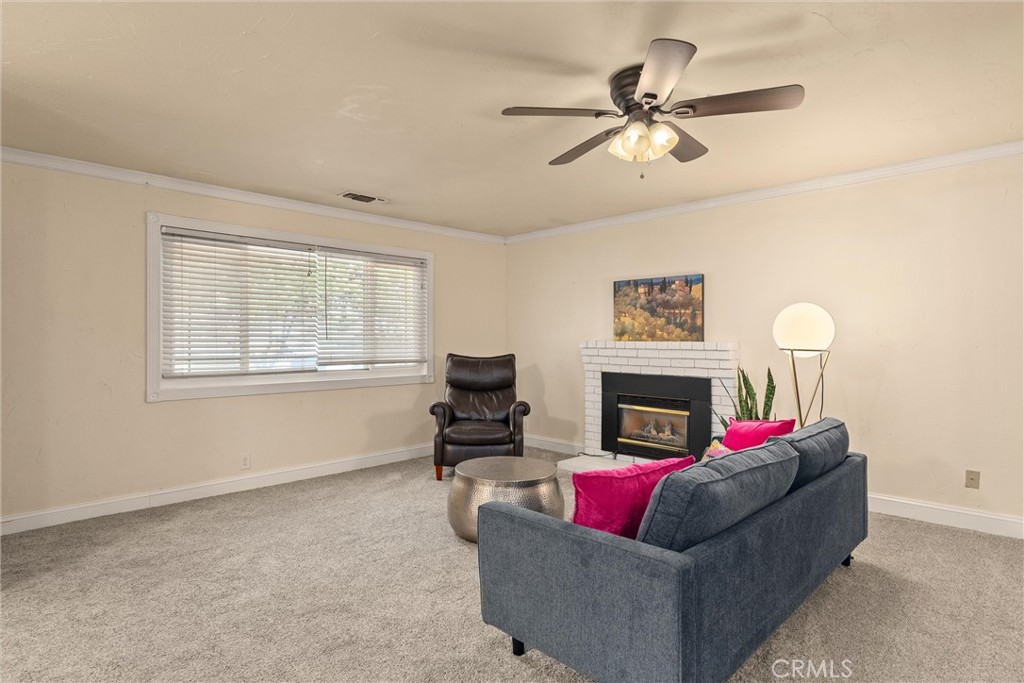 3030 Silverbell Road Chico, CA 95973 - Photo 19 of 42 a living room with furniture and a fireplace