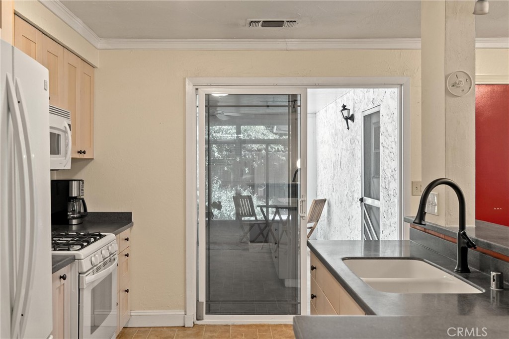 3030 Silverbell Road Chico, CA 95973 - Photo 22 of 42 a kitchen with sink refrigerator and stove