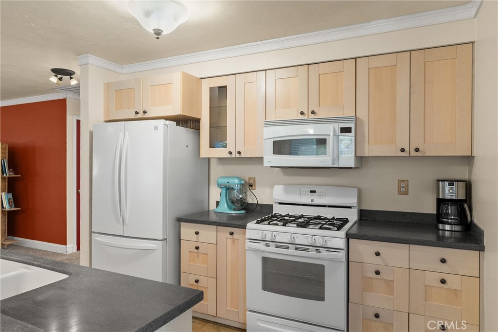 3030 Silverbell Road Chico, CA 95973 - Photo 23 of 42 a kitchen with stainless steel appliances white cabinets and a refrigerator