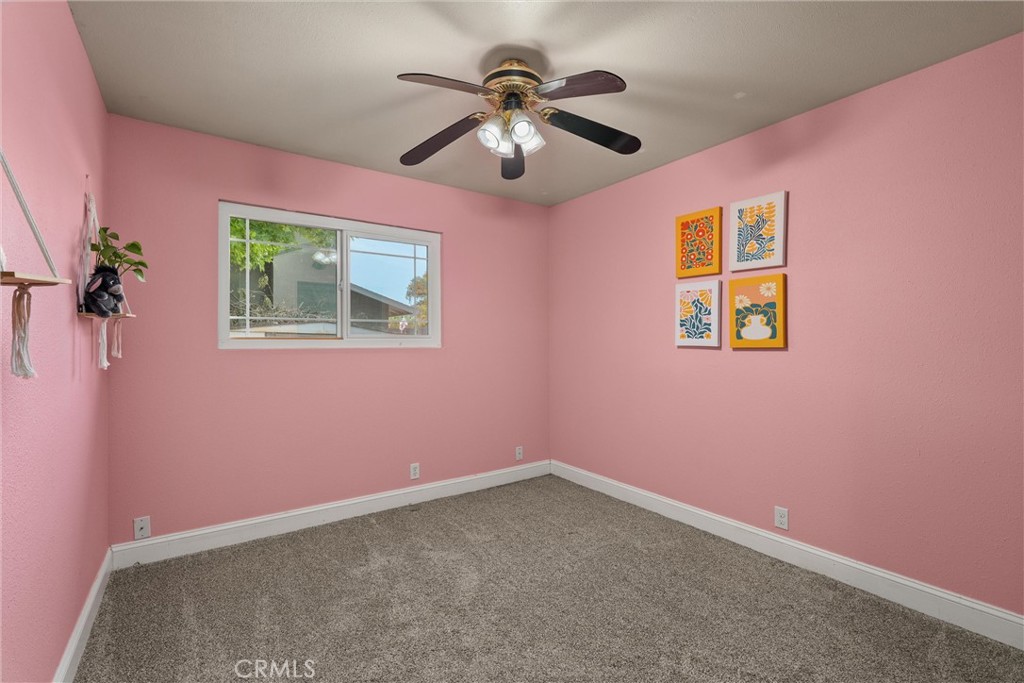 3030 Silverbell Road Chico, CA 95973 - Photo 27 of 42 a view of room with hardwood floor and ceiling fan