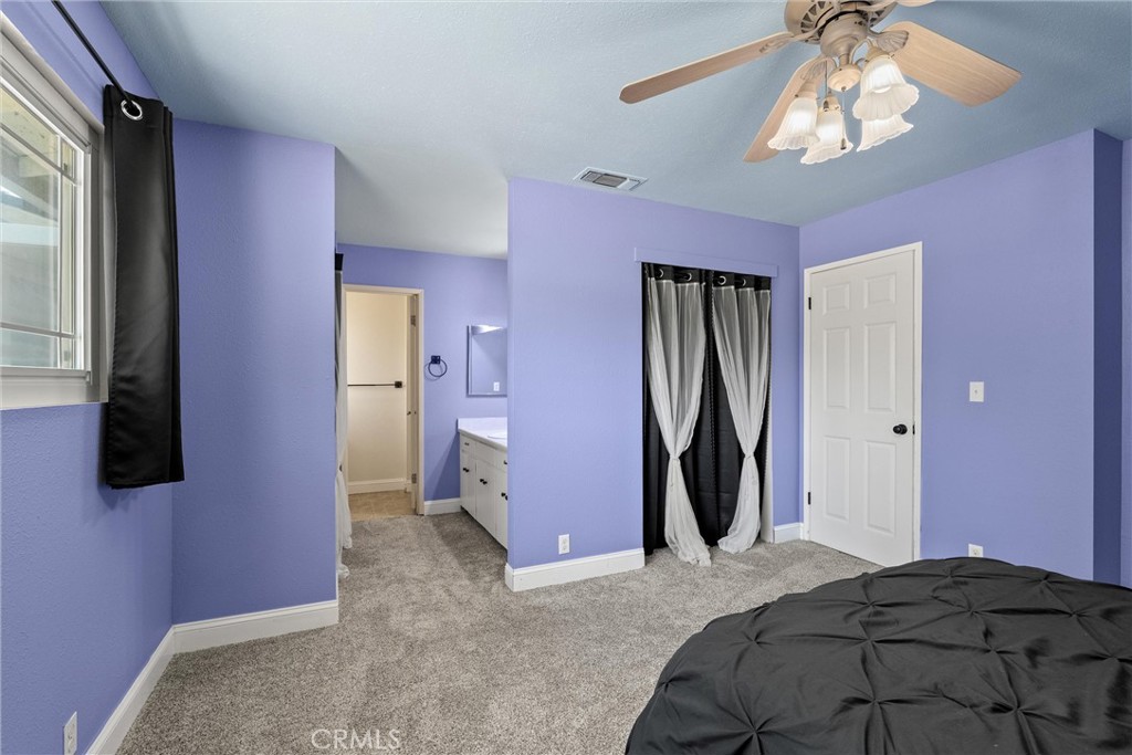 3030 Silverbell Road Chico, CA 95973 - Photo 30 of 42 a bed room with a bed and a flat screen tv