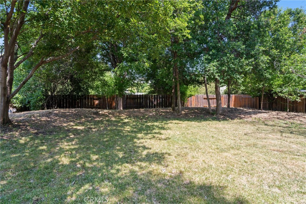 3030 Silverbell Road Chico, CA 95973 - Photo 36 of 42 a backyard of a house with a large tree