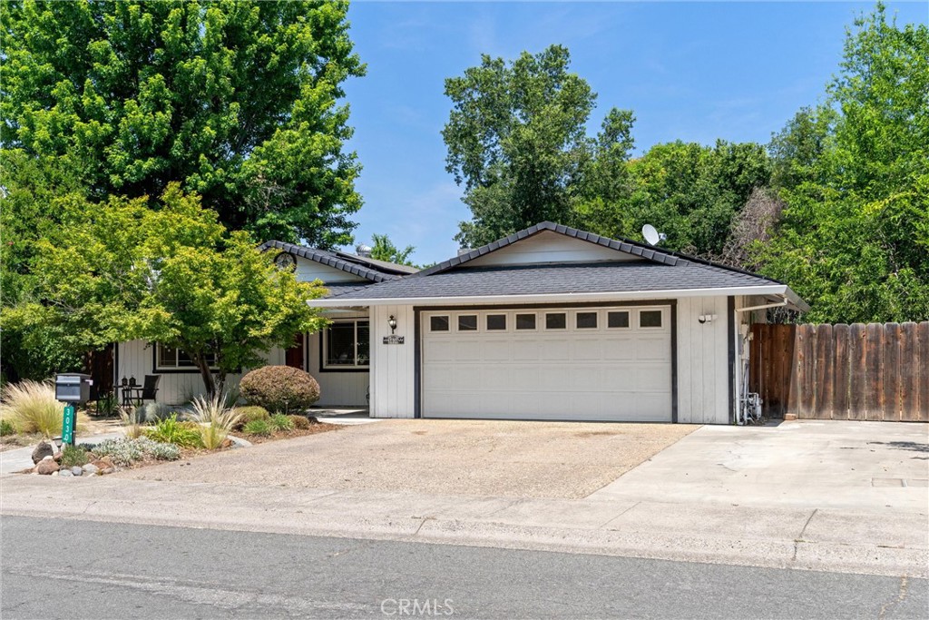 3030 Silverbell Road Chico, CA 95973 - Photo 8 of 42 a front view of a house with a yard and potted plants