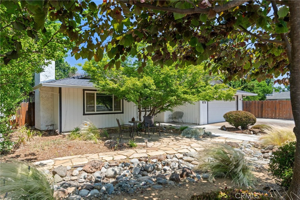 3030 Silverbell Road Chico, CA 95973 - Photo 9 of 42 a backyard of a house with yard and tree