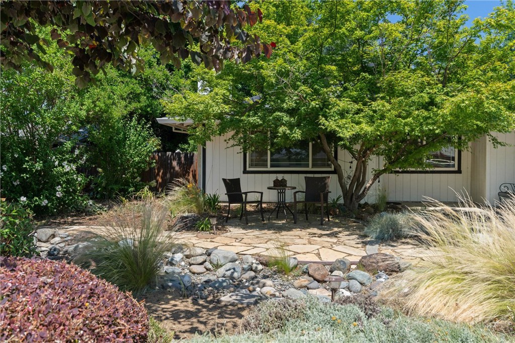 3030 Silverbell Road Chico, CA 95973 - Photo 10 of 42 a view of a house with a tree in the yard