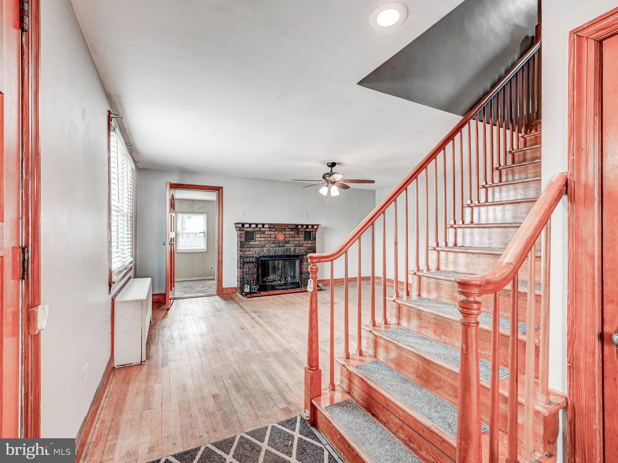 3206 Lynch Road Baltimore, MD 21219 - Photo 5 of 70 a view of an entryway with wooden floor and livingroom view