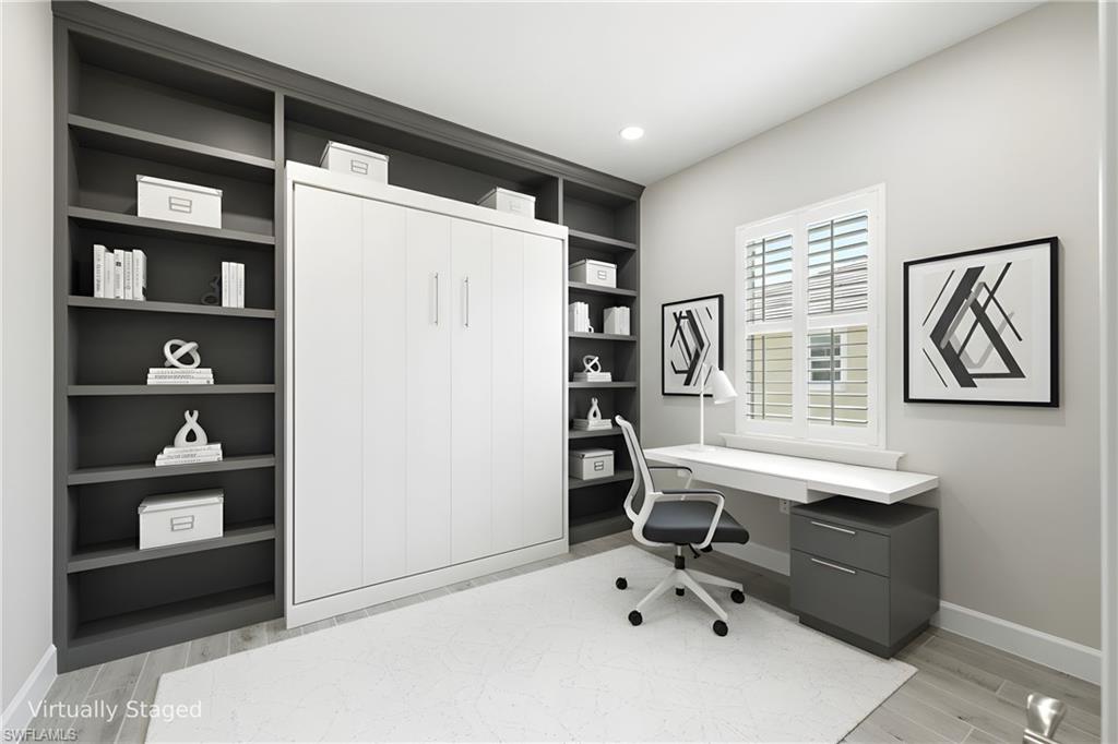 8937 Calypso Court Naples, FL 34113 - Photo 17 of 43 a room with furniture a air conditioner and a window