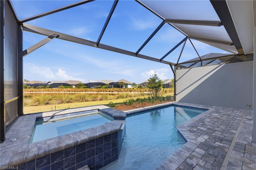 8937 Calypso Court Naples, FL 34113 - Photo 19 of 43 a view of a patio with a ocean view