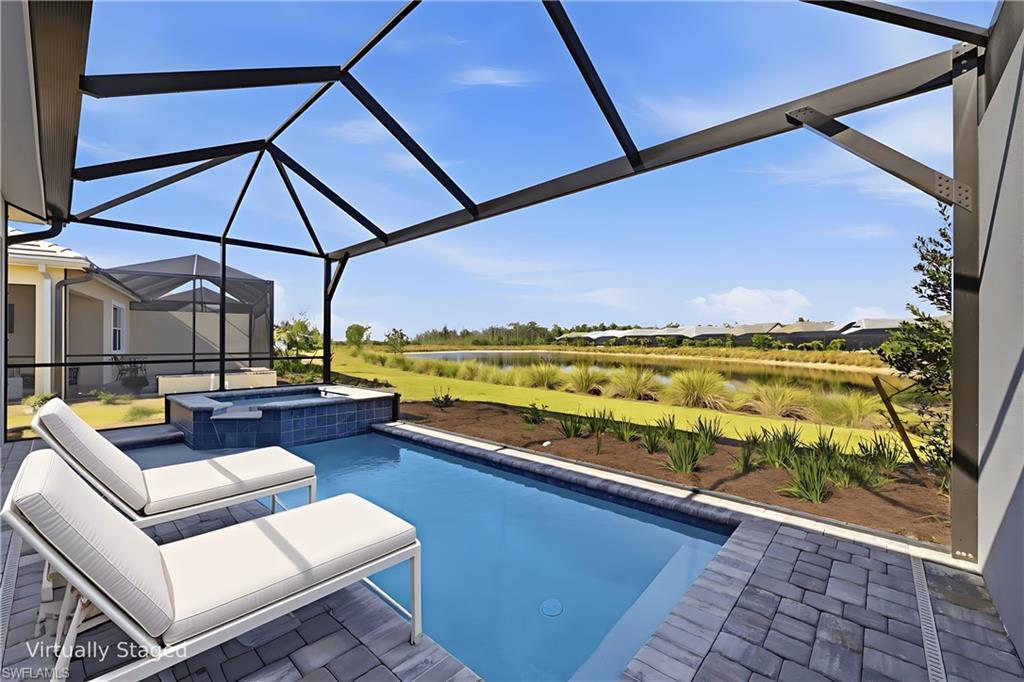 8937 Calypso Court Naples, FL 34113 - Photo 20 of 43 a view of swimming pool with a patio