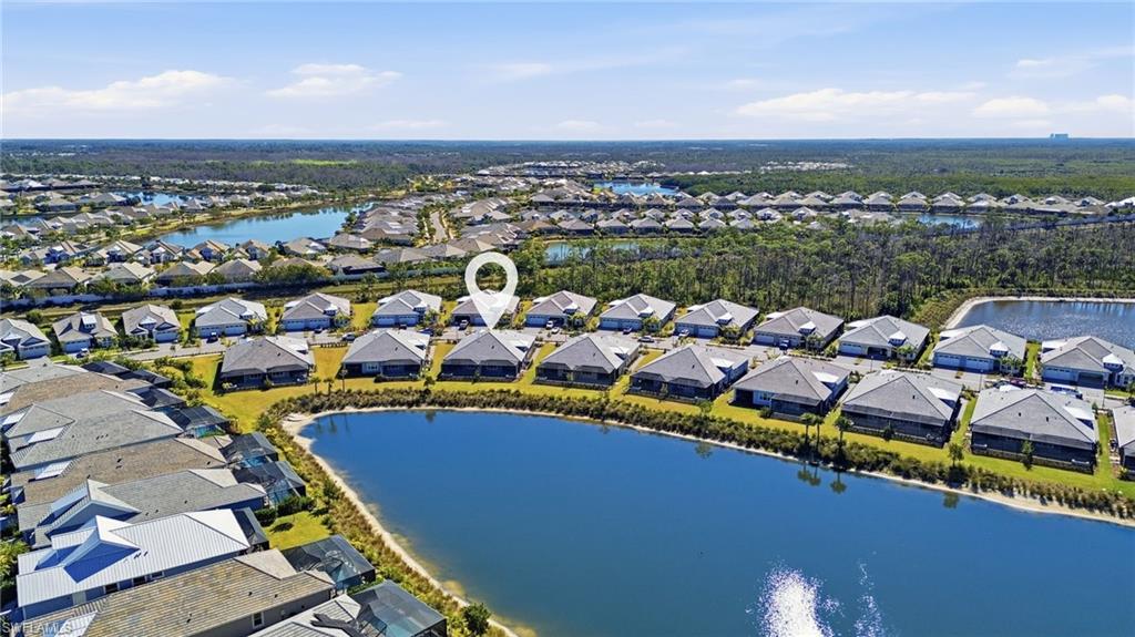 8937 Calypso Court Naples, FL 34113 - Photo 23 of 43 a view of a city with lawn chairs