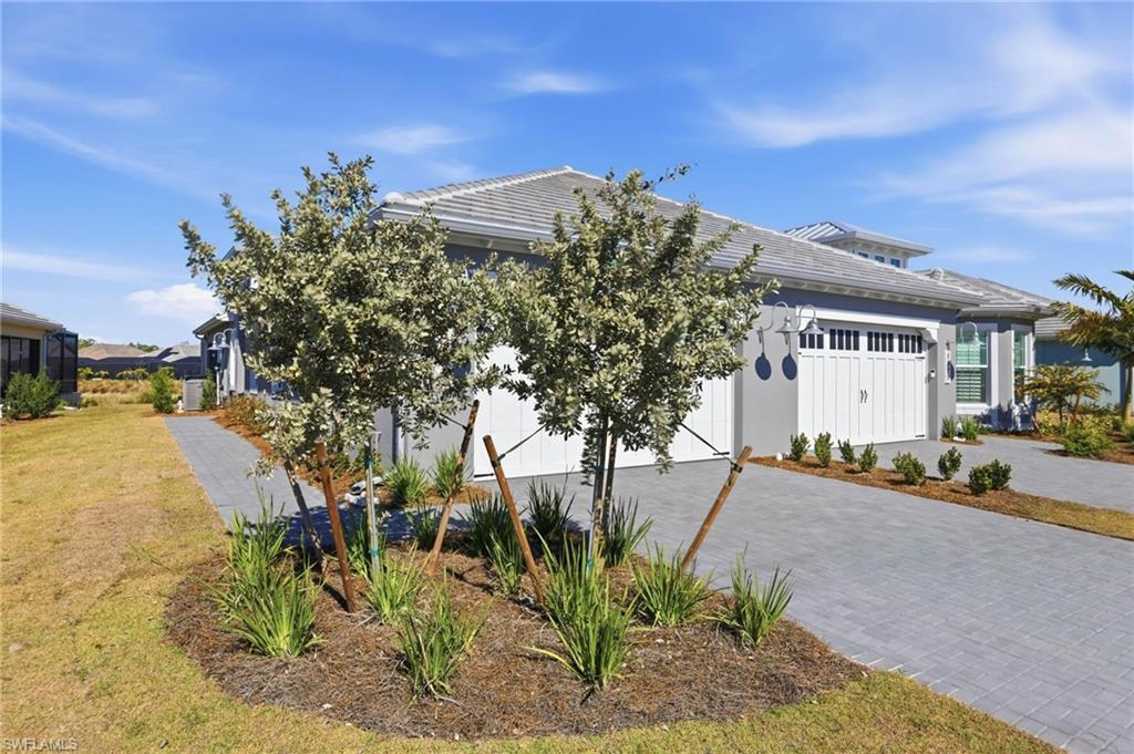 8937 Calypso Court Naples, FL 34113 - Photo 5 of 43 a view of a building with a street