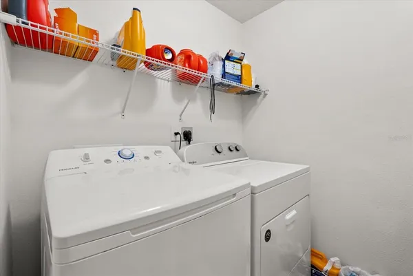 a utility room with dryer and washer