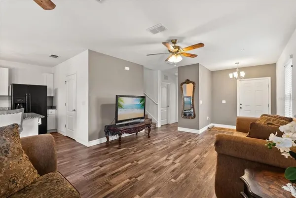a bedroom with a bed and a television
