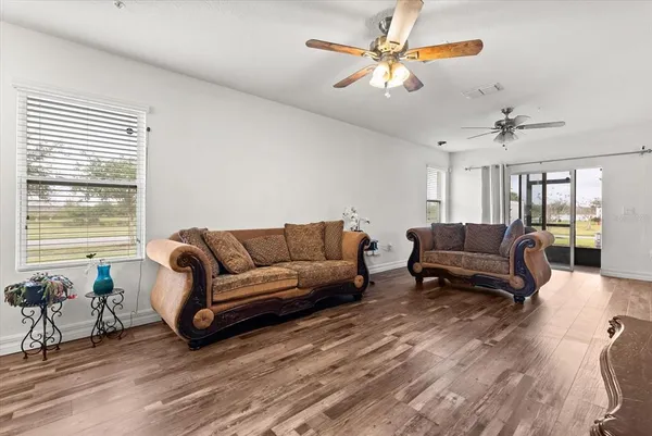 a living room with furniture and a large window