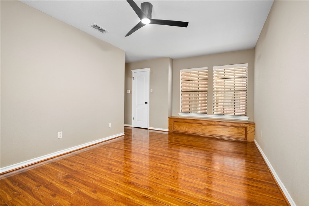 4177 Bobwhite Road Robstown, TX 78380 - Photo 25 of 32 wooden floor in an empty room with a window