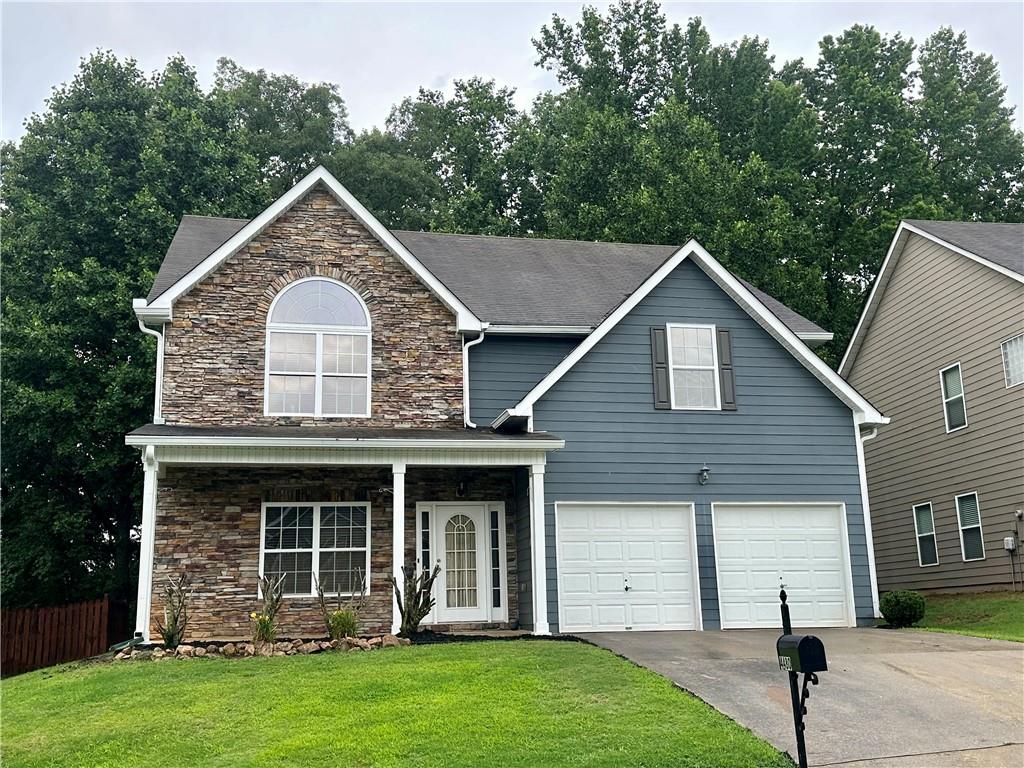 4480 Ambassador Way Cumming, GA 30040 - Photo 1 of 1 a view of a house with garden